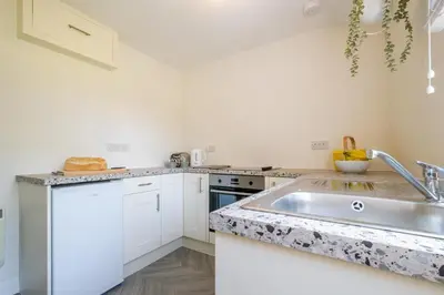 a kitchen with a sink and a counter top at 6 Uplands in Thorpeness