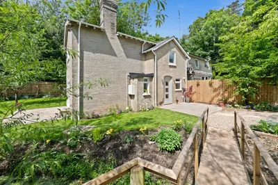 a house with a garden in front of it at Stunning 2 Lodge Cottage retreat in Little Saxham