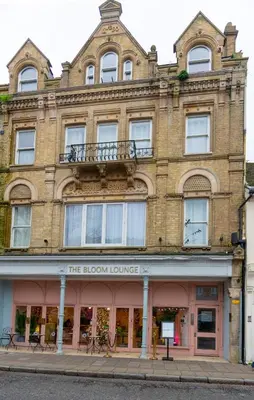 a large brick building on the corner of a street at Contractor's Haven 4BED 2BATH House in Ipswich with FREE Parking in Ipswich
