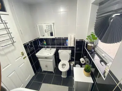 a small bathroom with a toilet and a sink at Single Room Near Basildon City Centre in Basildon