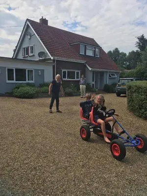 a woman pushing a child in a toy car at Tresco - Aldeburgh's hidden gem in Aldeburgh