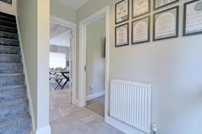 a hallway with a staircase and a stairway with a stair case at Modern 5-Bed Property, Ideal for Extended Business & Contractor Stays in Colchester