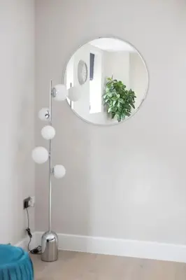 a white room with a mirror and a plant at Contemporary 3 Bedroom Fully Detached Town House in Wickford