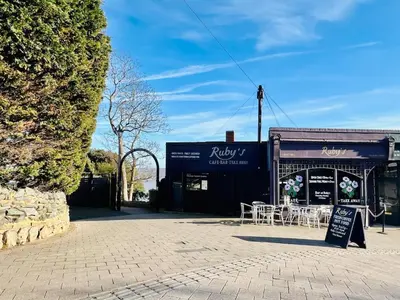 a building with a table and chairs in front of it at Unique Apartment with Stunning Views 2B in Felixstowe