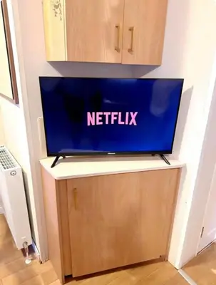 a tv sitting on top of a tv stand at Beatrice homes in Parkeston