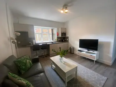 a living room with a couch and a coffee table at Dream Yard Apartments in Southend-on-Sea