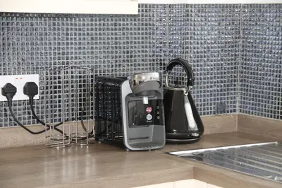a coffee maker on a counter in a kitchen at East Street Haven - Modern Apartment in Colchester in Colchester