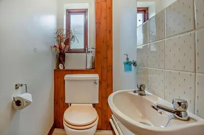 a bathroom with a toilet and a sink at 4 Bed in Woodbridge oc-s27356 in Martlesham