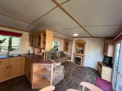 a kitchen and living room in a tiny house at The static, it is what it is! in Wicken