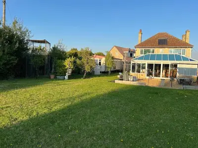 a house with a large yard with a large lawn at The static, it is what it is! in Wicken