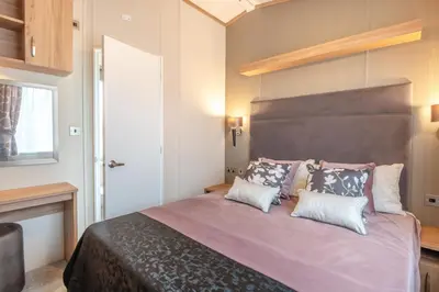 a bedroom with a large bed with two pillows at 2 Bed in Welney oc-c30124 in Welney