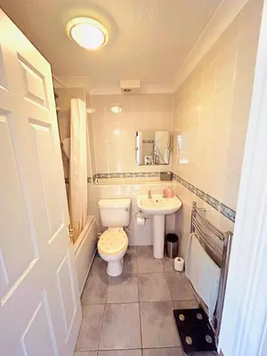 a bathroom with a toilet and a sink at 2 Bedroom House off A12 Colchester in Lexden