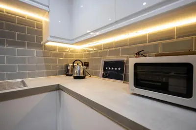 a kitchen with a microwave on a counter at Kingfisher in Haverhill