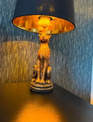a lamp sitting on top of a table at Newly decorated Cozy home! in Hythe