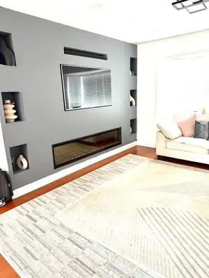 a living room with a fireplace and a couch at Rose home in Haverhill
