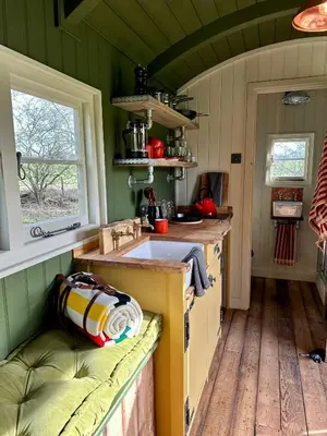 a kitchen with a sink and a counter top at Secret Paddock Shepherds Hut in Hollesley