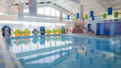 a large swimming pool in a large room at Caravan Hire Mersea Island - EOEPS in East Mersea