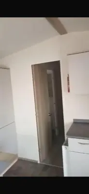 an empty room with a door and a hallway at 911 Caravan in Saint Osyth