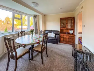 a dining room with a table and chairs at Lowal House - Uk46054 in Saffron Walden