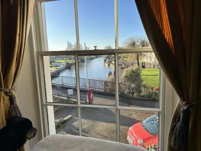 a view of a river from a window at Peacocks Tearoom and Fine B&B in Ely