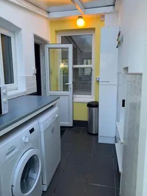 a laundry room with a washer and dryer at 3 Bed Family House Free Parking in Southend-on-Sea