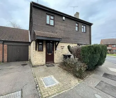 a large house with a garage and a driveway at Brackens House Brentwood in Little Warley
