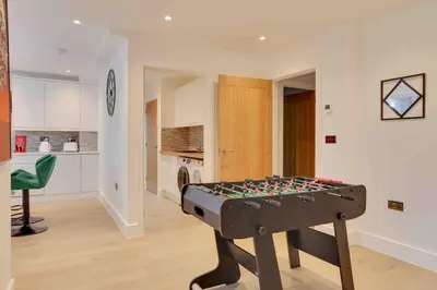 a room with a pool table in the middle of a room at Foxglove House & Hot Tub Stansted Airport in London Stansted Airport