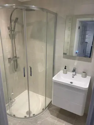 a bathroom with a shower and a sink at Priory View in Saint Osyth