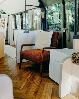 a room with a chair in a bus at Mind The Gap in Preston