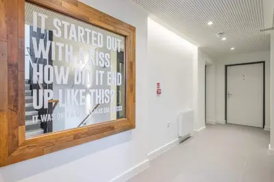 a hallway with a painting on the wall at Stunning Central Apt - Balcony & Parking in Cambridge