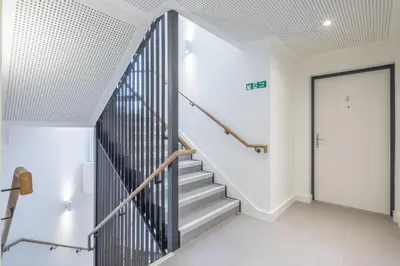 a staircase in a house with a door at Beautiful Central Apt With Parking in Cambridge