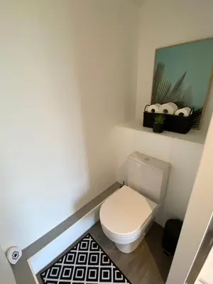 a small bathroom with a toilet and a shelf at The Old Stable 1 in Messing