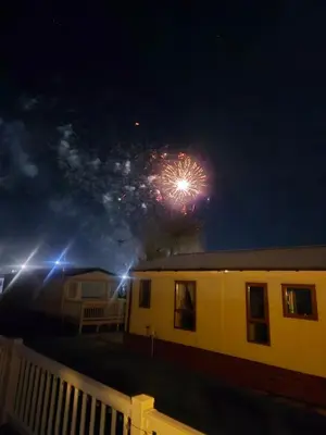 a firework display in the sky over a house at 3 Bedroom 2 Bathroom Caravan Charlie Delta in Saint Osyth