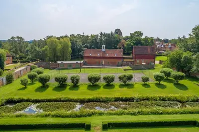 an aerial view of a garden and a barn at Belchamp Hall Coach House in Belchamp Otten