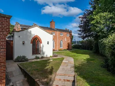an exterior view of a brick house at The Cat House in Woolverstone