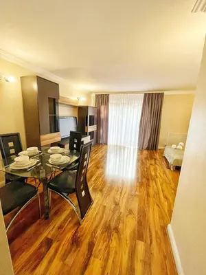 a dining room with a table and chairs in a room at Modern 3 Bed House In Essex By DLuxoria Short Lets & Serviced Accommodation With Pet Friendly, Free WiFi & Free Parking in Basildon