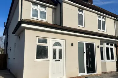 a house with a white door and windows at Captivating 7 -Bed House in Waltham Abbey in Waltham Abbey