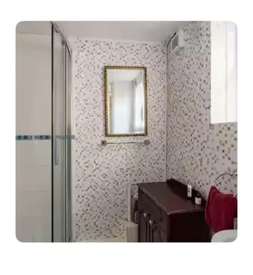 a bathroom with a shower and a sink and a mirror at Nice and spacious room in Chesterton
