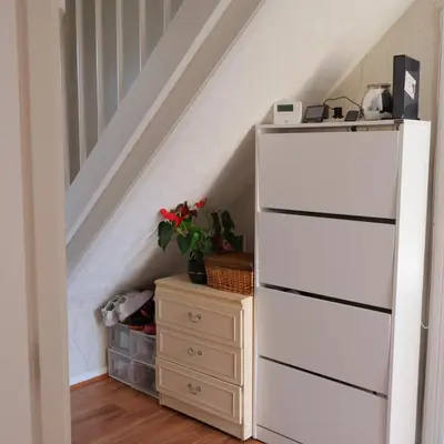 a white chest of drawers in a stair room at Nice and spacious room in Chesterton