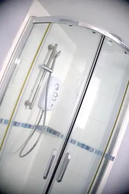 a glass display case with two toothbrushes at Nice and spacious room in Chesterton