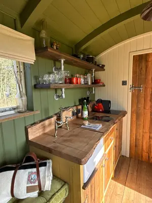 a kitchen with a sink and a counter at 'Russet' Hut on fruit farm in Charsfield