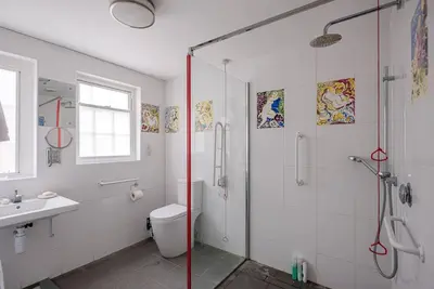 a bathroom with a shower and a toilet and a sink at Art Cottage, Aldeburgh in Aldeburgh