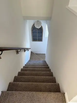 a staircase leading up to a window in a building at Place to stay up Ipswich near the train station, football stadium, waterfront in Ipswich