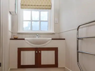 a bathroom with a sink and a window at The Woodshed in Clacton-on-Sea