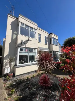 a large white building with a lot of windows at Salvation View 2 Bed Apartment in Hadleigh