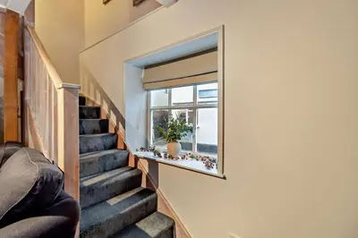 a staircase in a house with a window at 2 Bed in Lavenham oc-t30056 in Lavenham