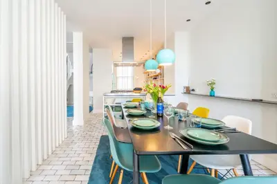 a dining room with a table and chairs at Edinburgh House in Aldeburgh