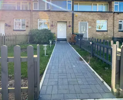 a walkway in front of a house with a fence at Basildon Retreat Cozy 3-Bedroom Home in Basildon