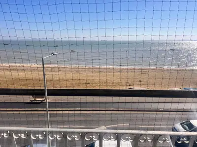 a view of the beach from a balcony at Seaside Escape in Thorpe Bay