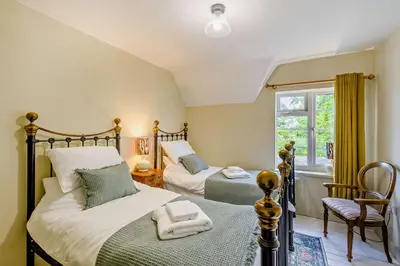 a bedroom with two beds and a window at 2 Bed in Holbrook oc-31111 in Holbrook